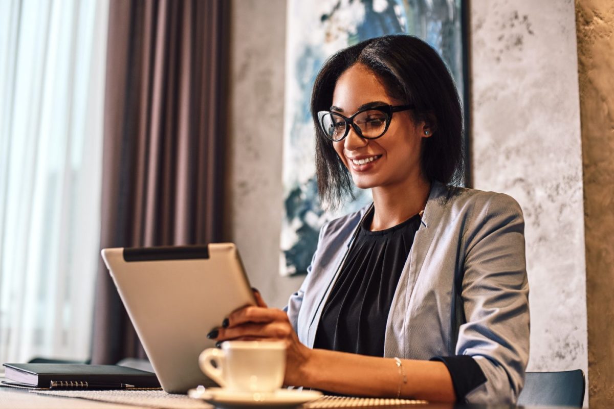 All good work requires self-revelation. Shot of a young mixed race businesswoman using tablet while